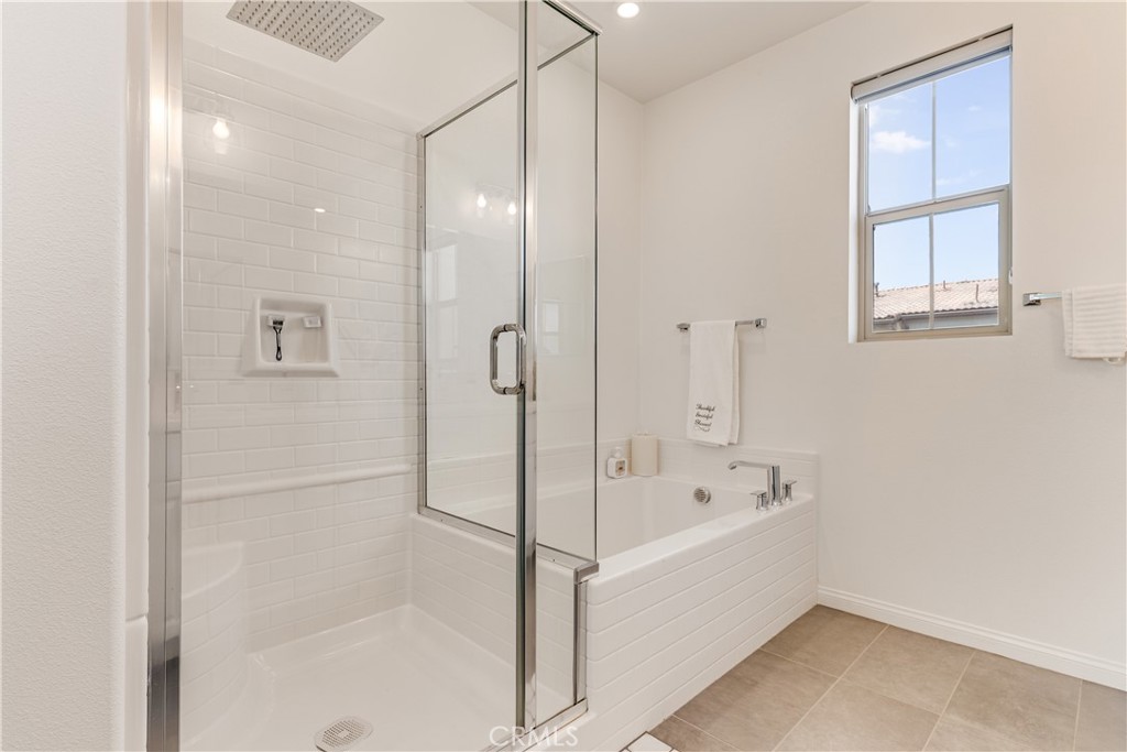 1648 Fig Tree Way Oceanside, CA 92056 - Photo 41 of 45 a bathroom with a bathtub and a shower