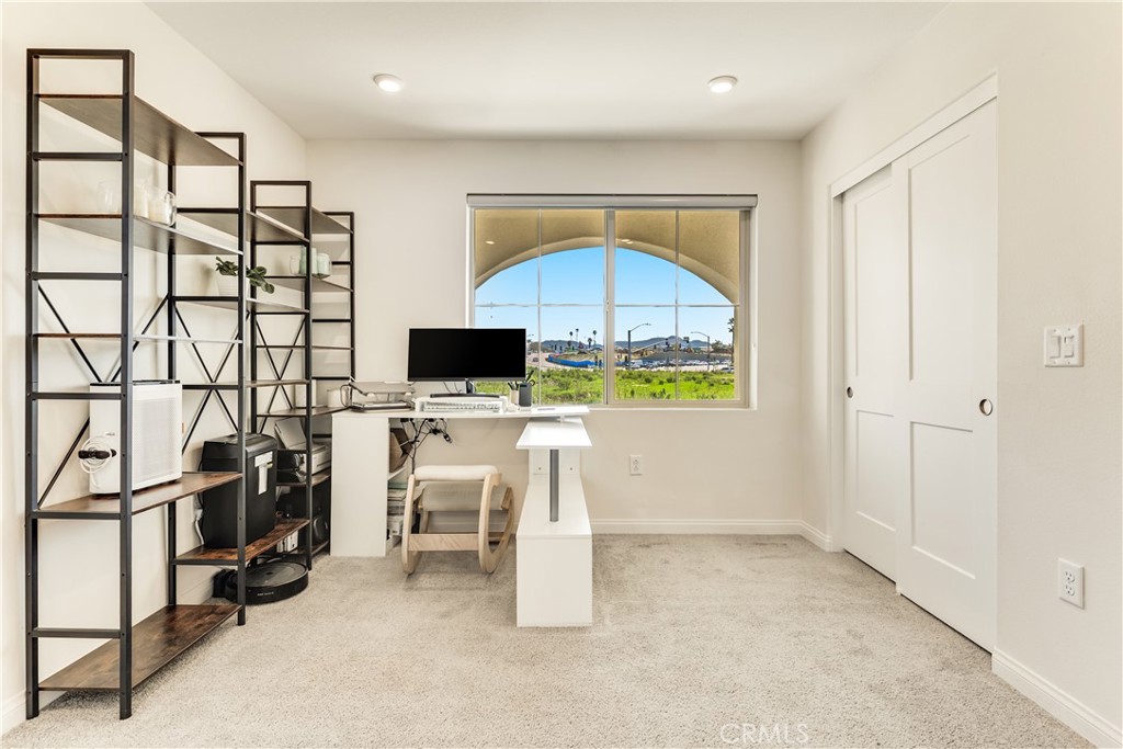 1648 Fig Tree Way Oceanside, CA 92056 - Photo 7 of 45 a view of workspace with flat screen tv