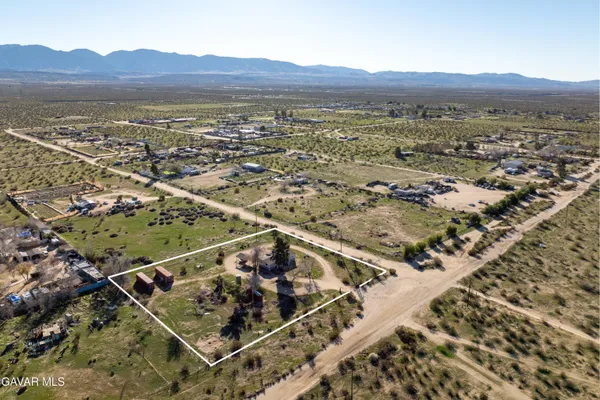 an aerial view of residential house and green space