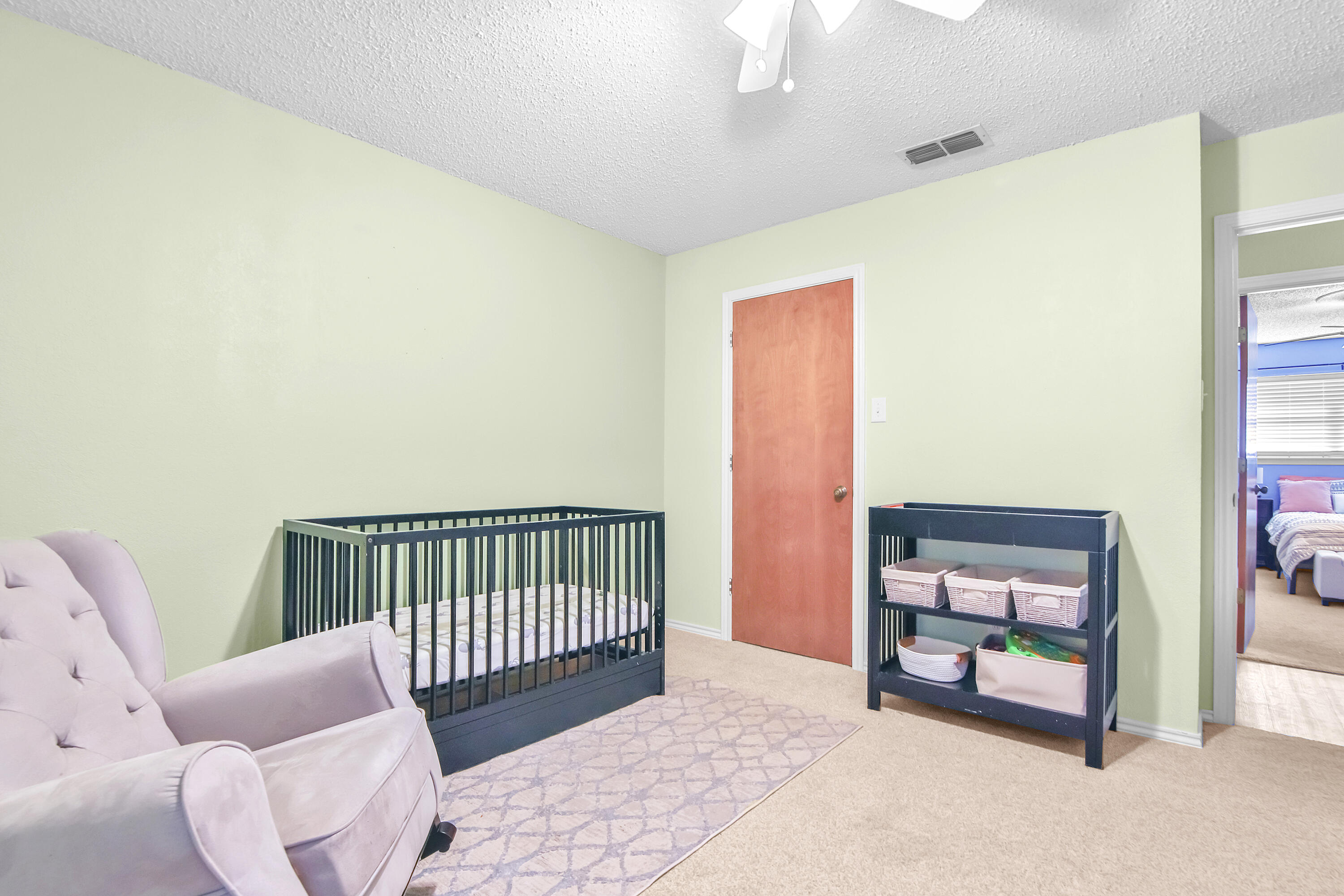 4805 73rd Street Lubbock, TX 79424 - Photo 23 of 26 a bedroom with furniture and a window