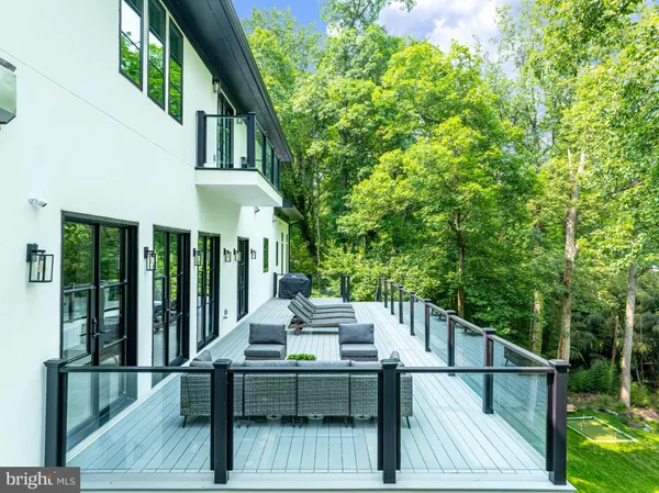 a view of a patio with table and chairs and wooden floor