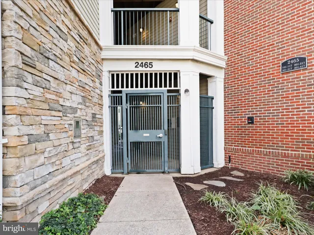 a group of couches and a fireplace in a room