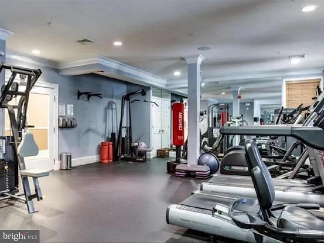 a living room with furniture cabinets and book shelf