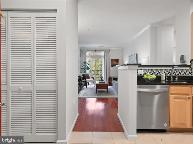 a kitchen with a refrigerator and a stove