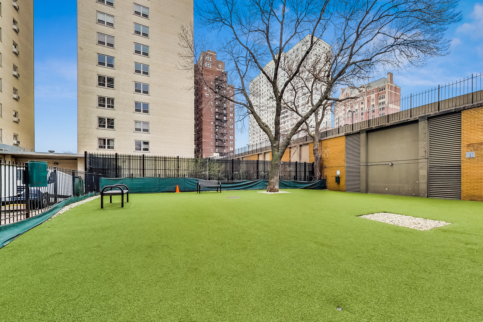 655 West Irving Park Road, Unit 606 Chicago, IL 60613 - Photo 25 of 28 a view of a chair and table in the backyard