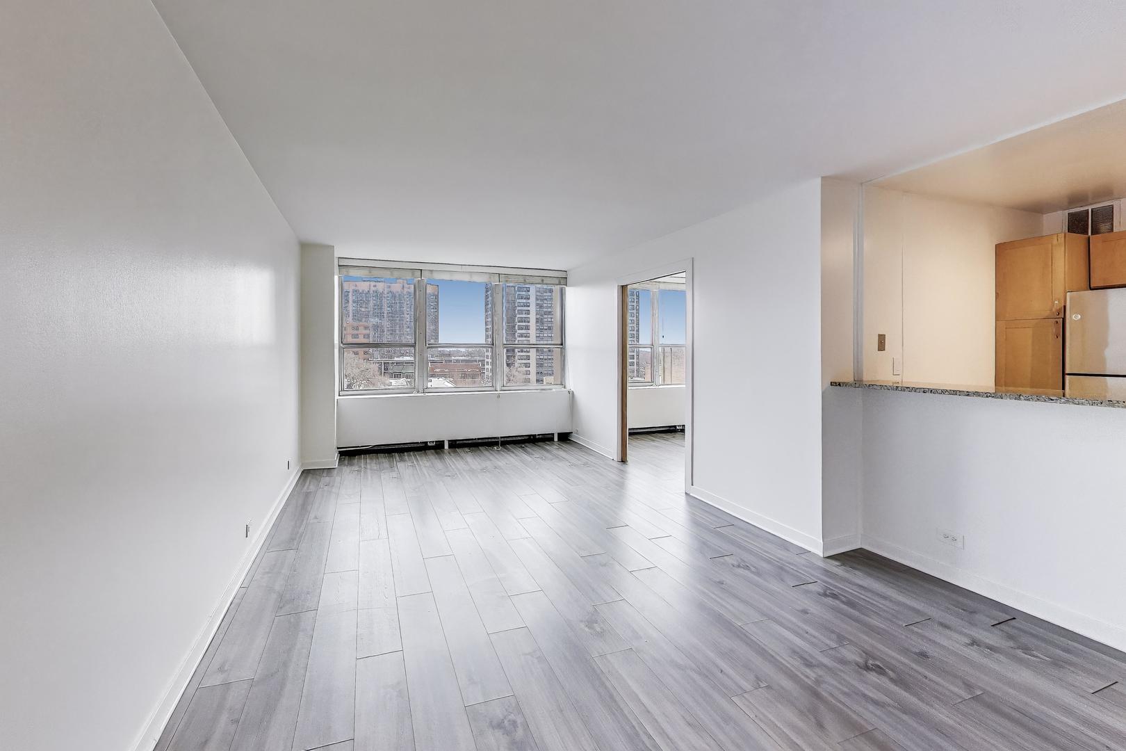 655 West Irving Park Road, Unit 606 Chicago, IL 60613 - Photo 6 of 28 a view of a room with wooden floor