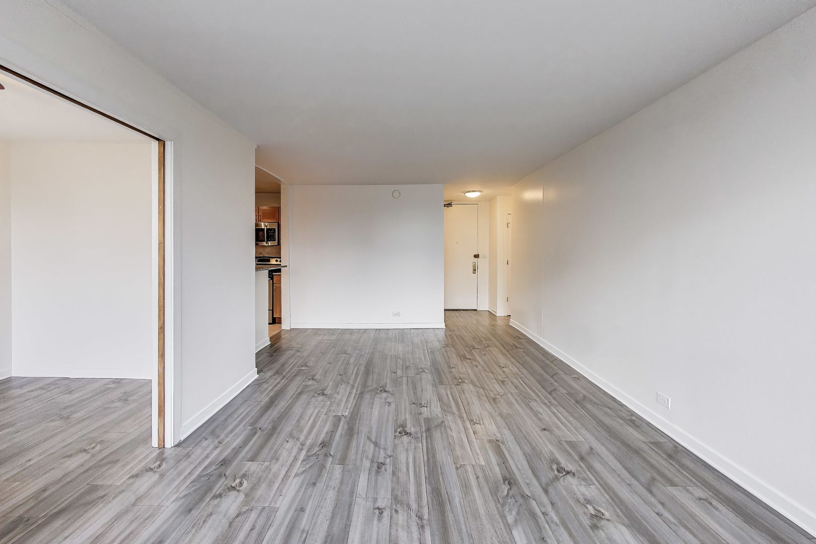 655 West Irving Park Road, Unit 606 Chicago, IL 60613 - Photo 8 of 28 a view of wooden floor in an empty room