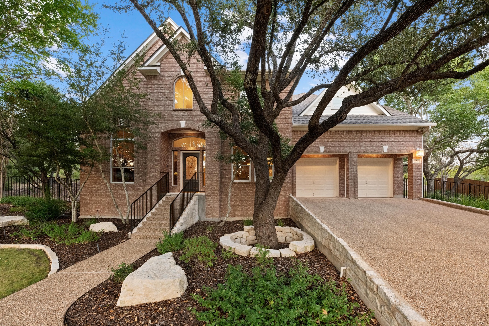 3713 Soledad Court Austin, TX 78732 - Photo 2 of 40 a front view of a house with garden