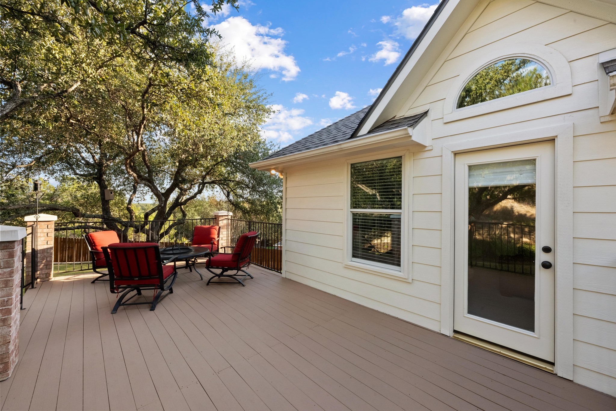 3713 Soledad Court Austin, TX 78732 - Photo 21 of 40 a view of a house with a barbeque and bench