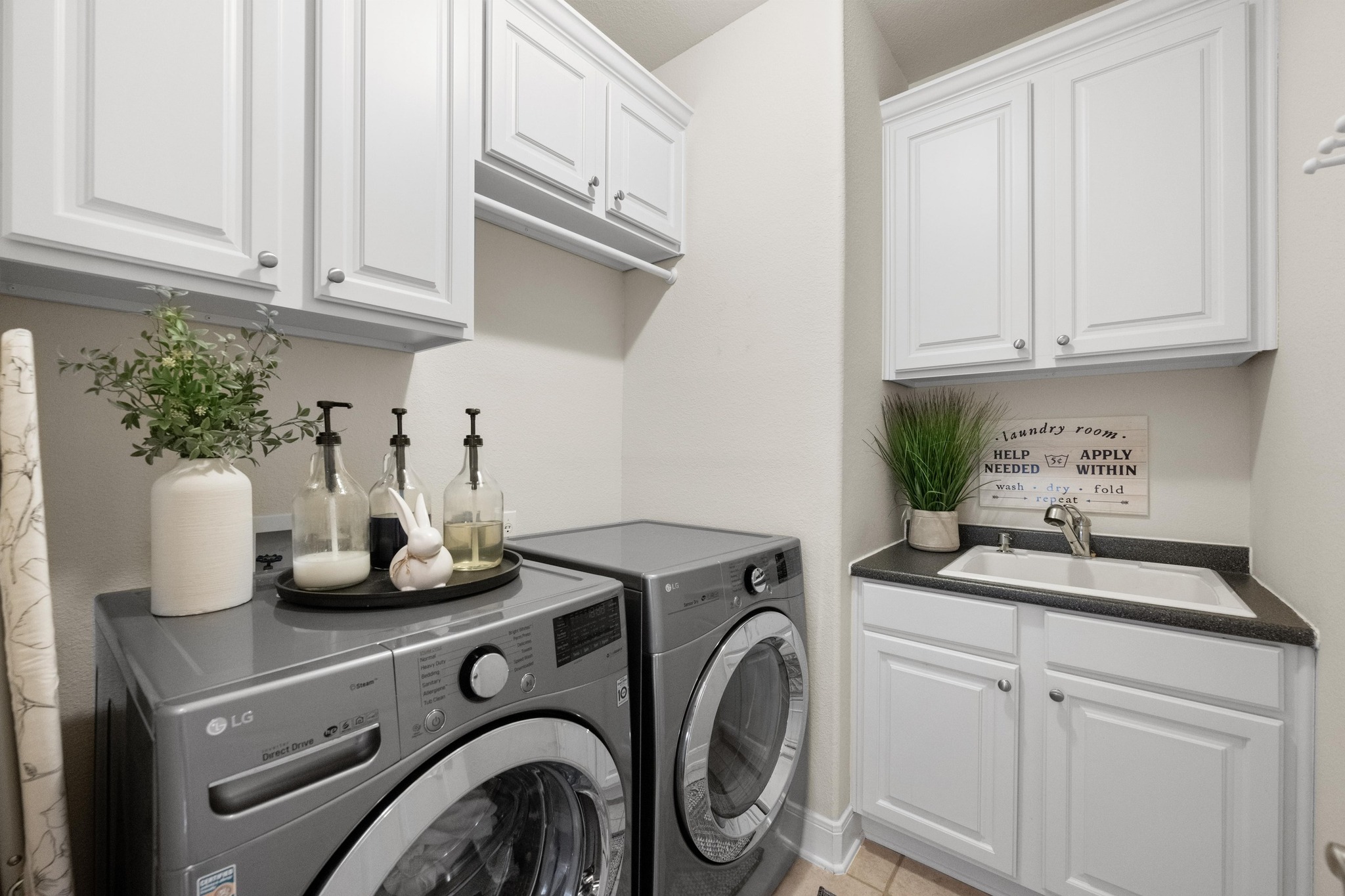 3713 Soledad Court Austin, TX 78732 - Photo 28 of 40 a kitchen with a sink and cabinets