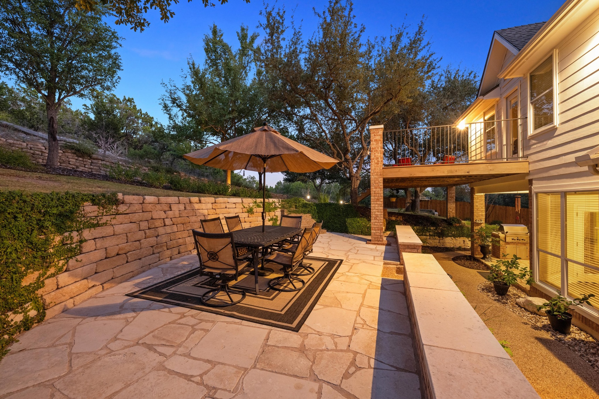 3713 Soledad Court Austin, TX 78732 - Photo 32 of 40 a view of a patio with chairs and umbrellas on a patio