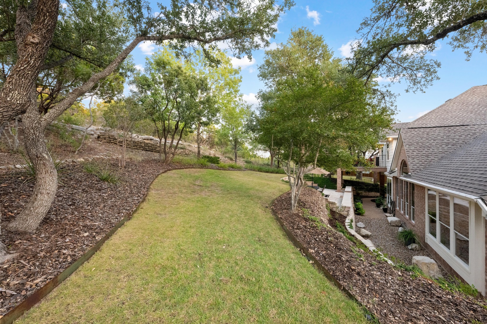 3713 Soledad Court Austin, TX 78732 - Photo 34 of 40 a view of a backyard with sitting area