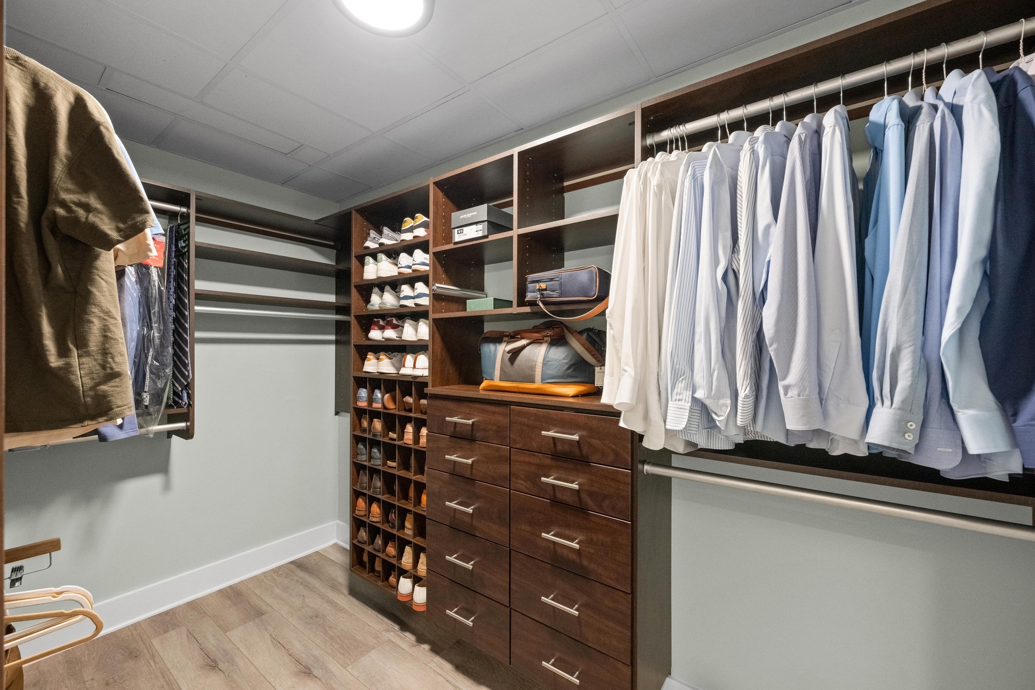 603 Davis Street, Unit 1002 Austin, TX 78701 - Photo 16 of 40 a view of walk in closet with clothes and shoes