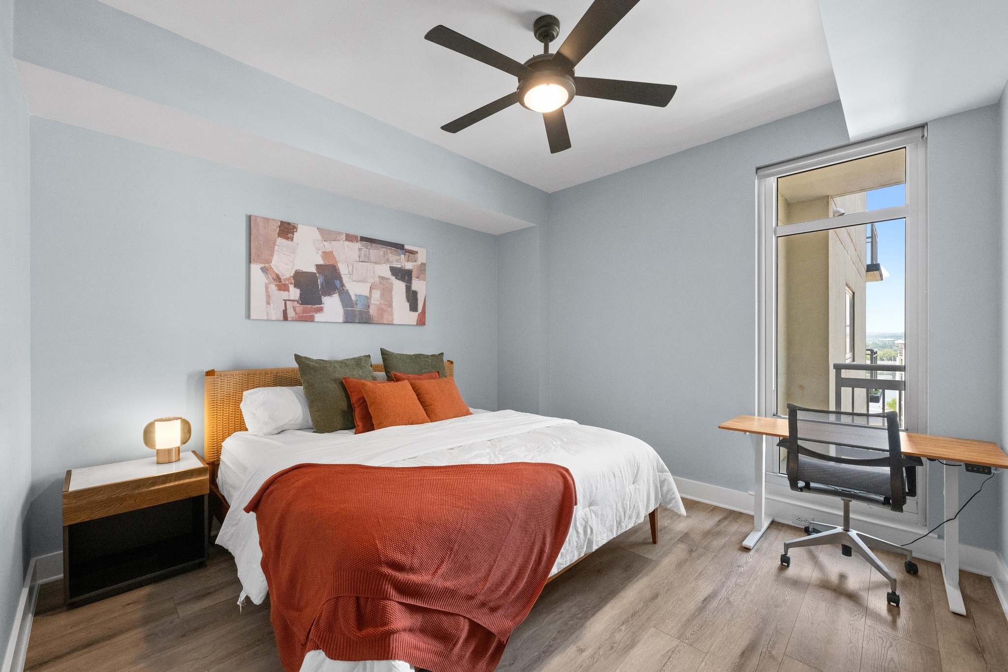 603 Davis Street, Unit 1002 Austin, TX 78701 - Photo 17 of 40 a bedroom with a bed and a chandelier