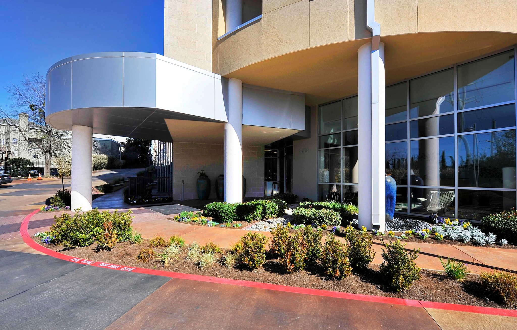 603 Davis Street, Unit 1002 Austin, TX 78701 - Photo 23 of 40 a front view of a house with a yard