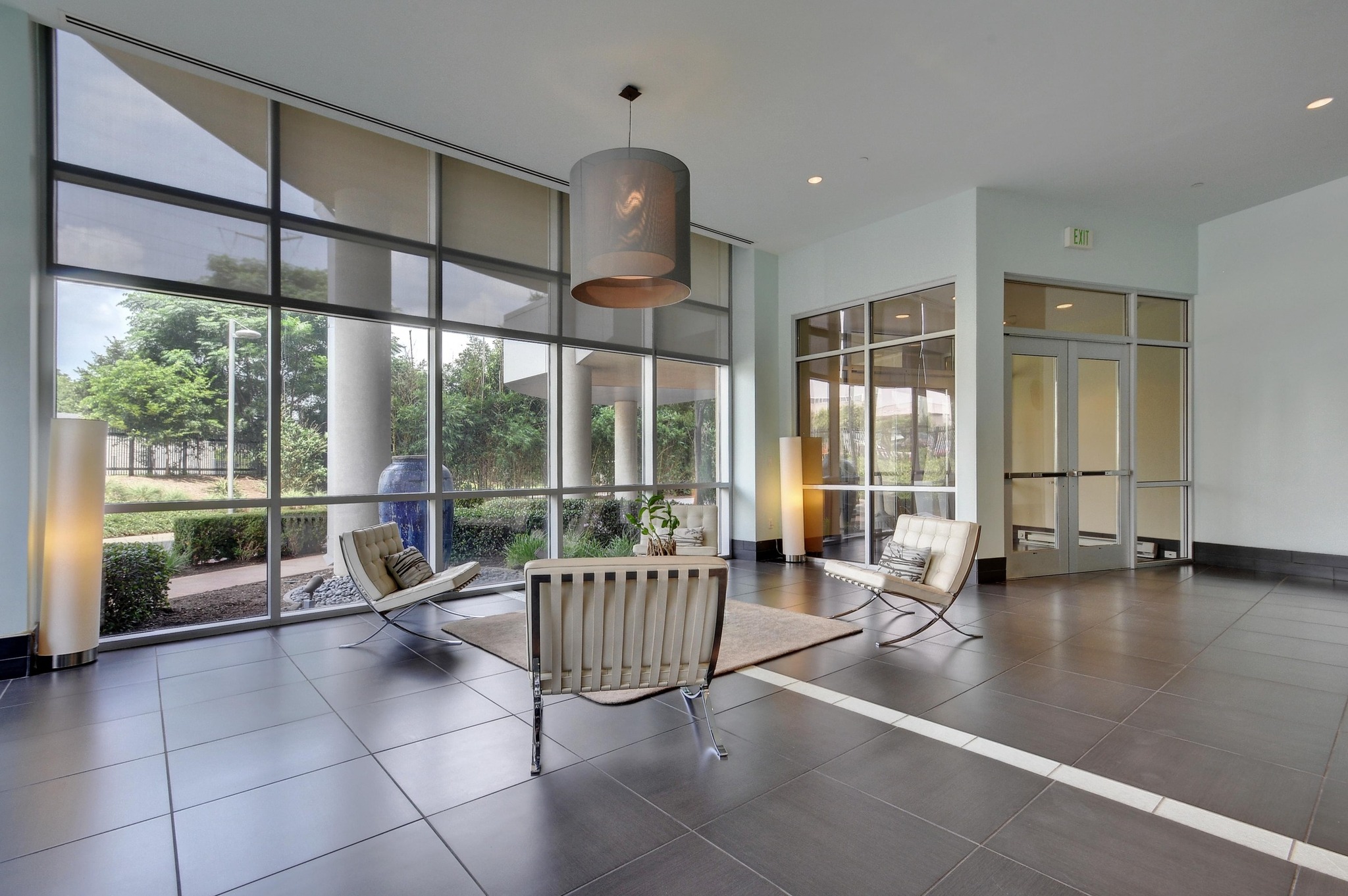 603 Davis Street, Unit 1002 Austin, TX 78701 - Photo 38 of 40 a room with lots of furniture and windows