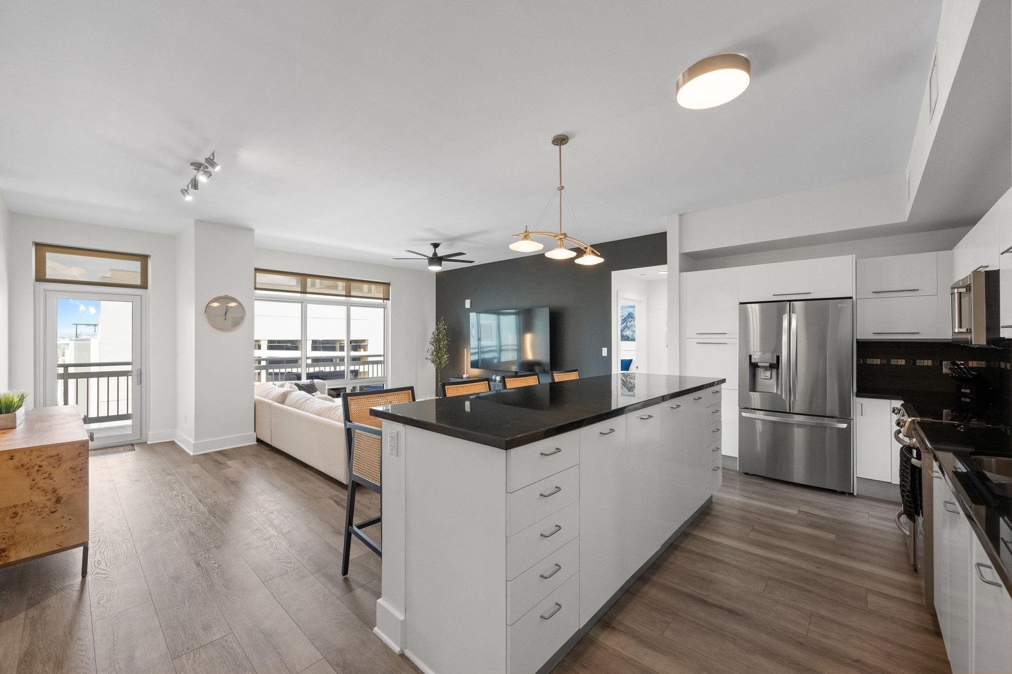 603 Davis Street, Unit 1002 Austin, TX 78701 - Photo 40 of 40 a kitchen with stainless steel appliances kitchen island sink refrigerator and wooden floor