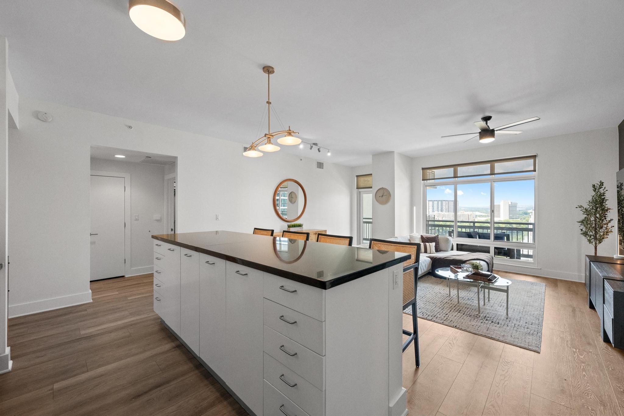 603 Davis Street, Unit 1002 Austin, TX 78701 - Photo 9 of 40 a very nice looking living room with a large window and wooden floor