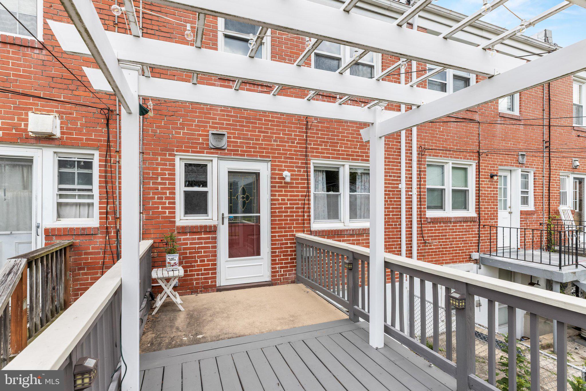 309 Leeanne Road Baltimore, MD 21221 - Photo 16 of 42 Deck with Pergola off Kitchen