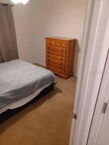a bedroom with a bed and a shower
