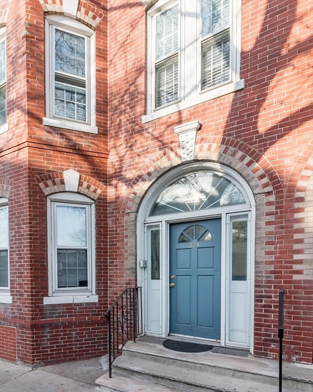 front view of a brick house with a door