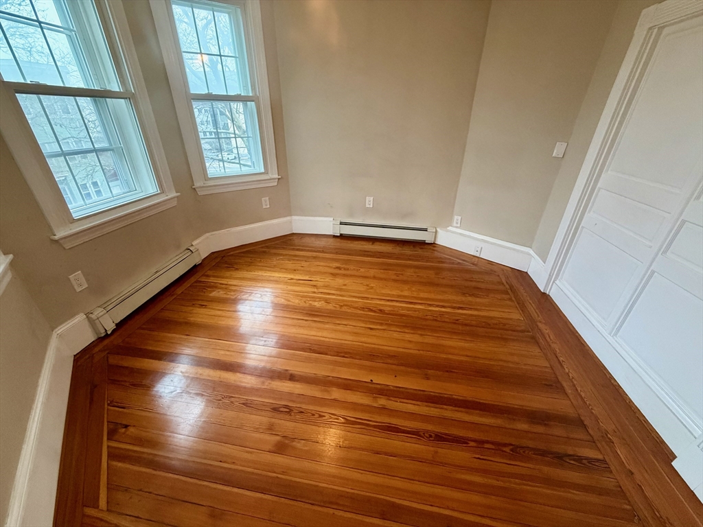 324 Chelsea Street, Unit 3 Boston, MA 02128 - Photo 16 of 20 a view of an empty room with windows