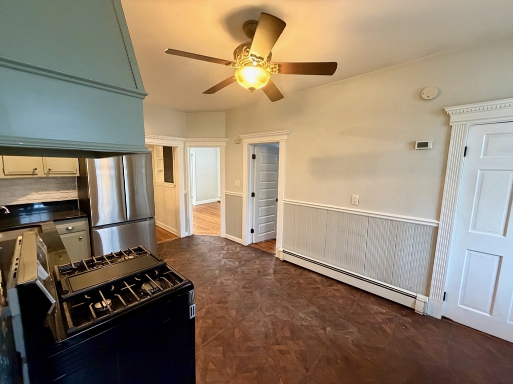 324 Chelsea Street, Unit 3 Boston, MA 02128 - Photo 4 of 20 a kitchen with a stove and a refrigerator