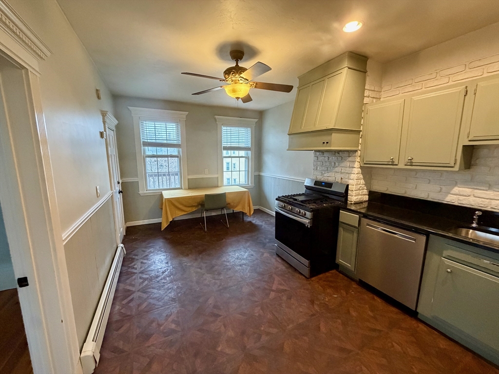 324 Chelsea Street, Unit 3 Boston, MA 02128 - Photo 5 of 20 a living room with furniture and a chandelier