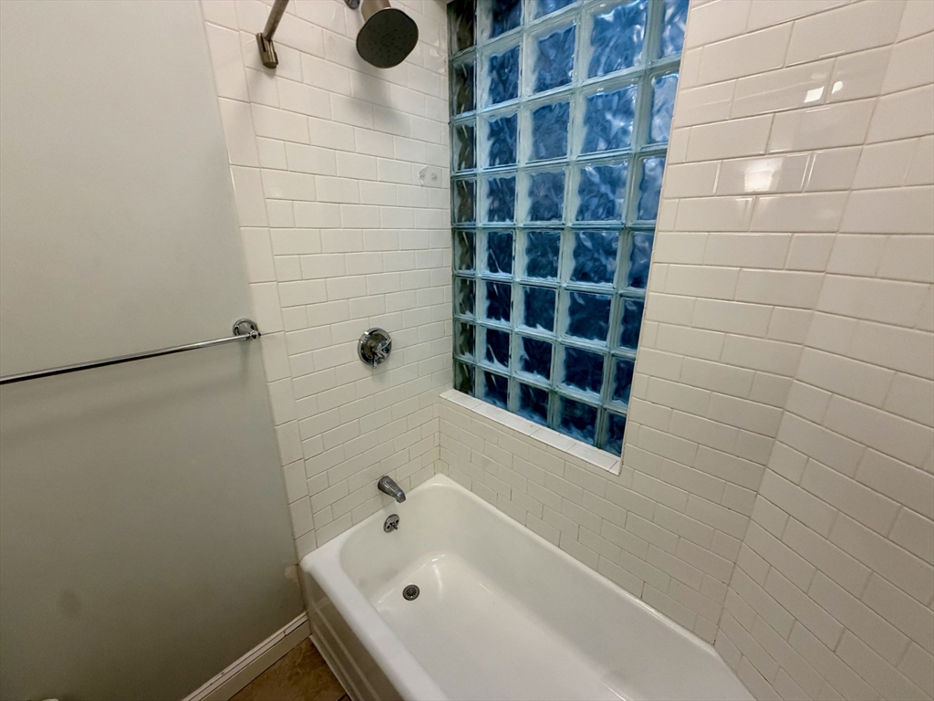 324 Chelsea Street, Unit 3 Boston, MA 02128 - Photo 6 of 20 a bathroom with a bathtub