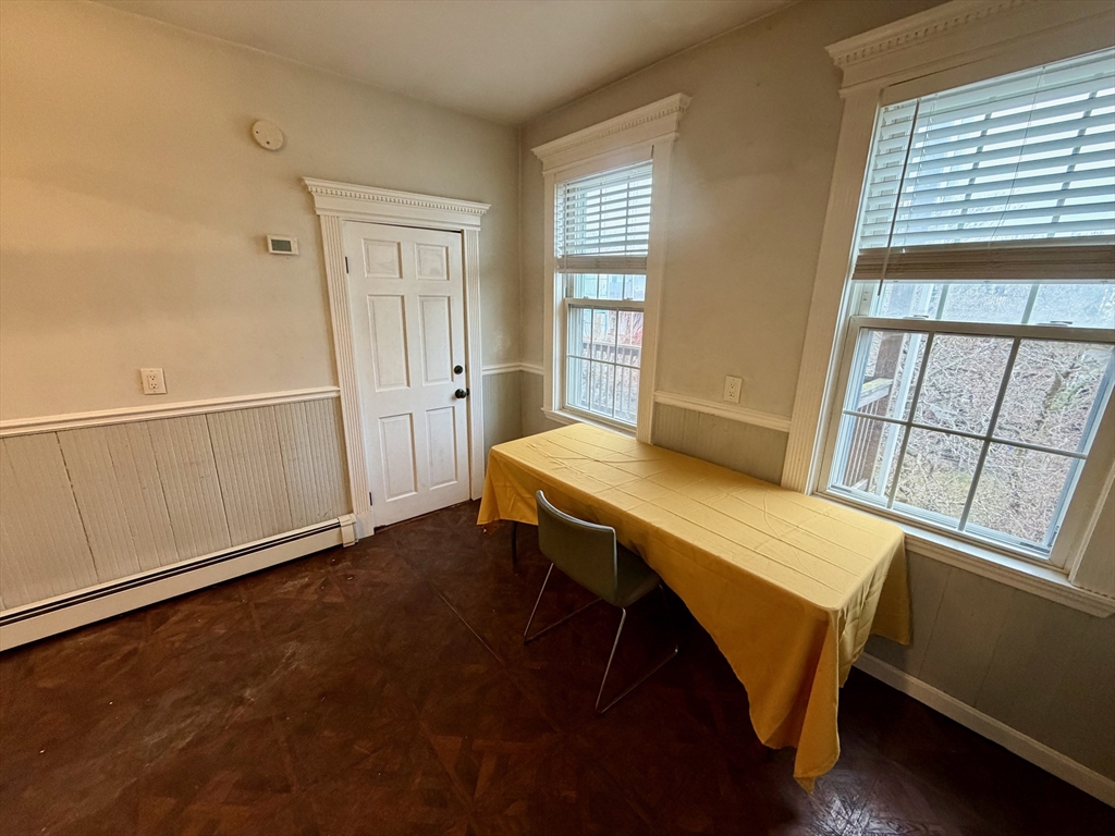 324 Chelsea Street, Unit 3 Boston, MA 02128 - Photo 8 of 20 a view of a room with furniture and wooden floor