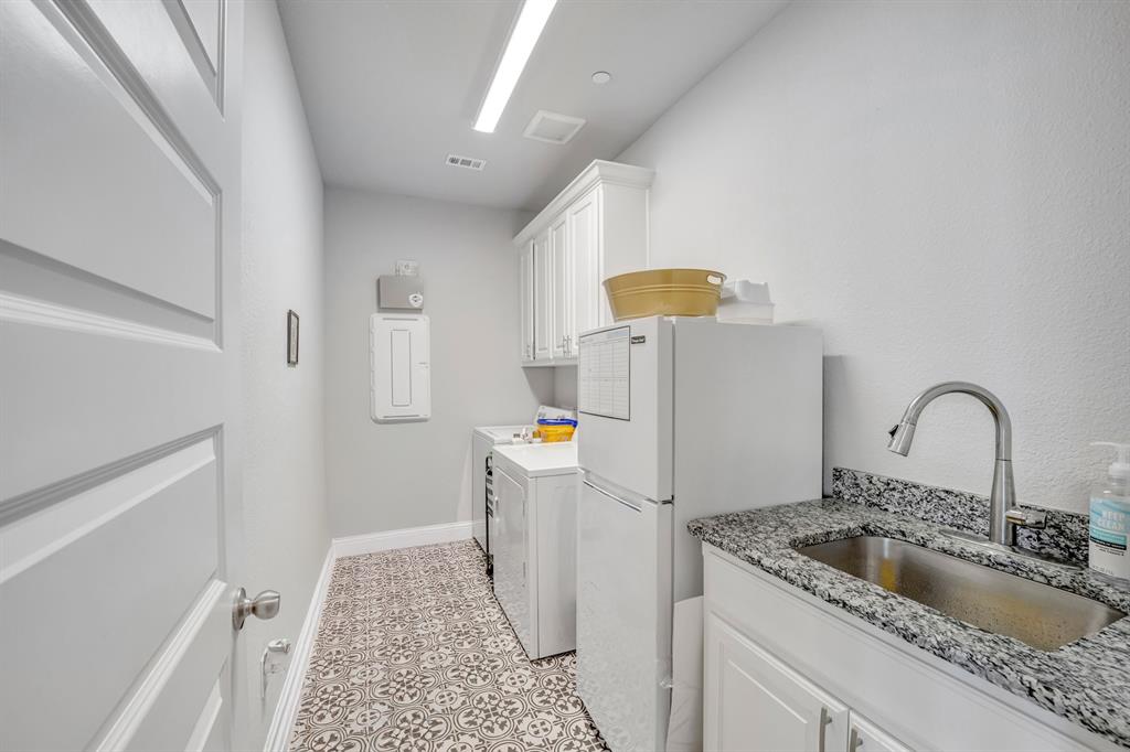 1340 Driftwood Lane Lucas, TX 75002 - Photo 12 of 23 a kitchen with a sink a refrigerator and a stove top oven