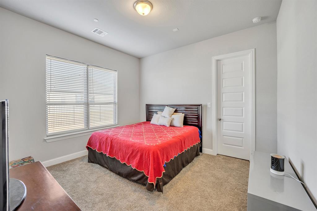 1340 Driftwood Lane Lucas, TX 75002 - Photo 20 of 23 a bedroom with a bed and a window