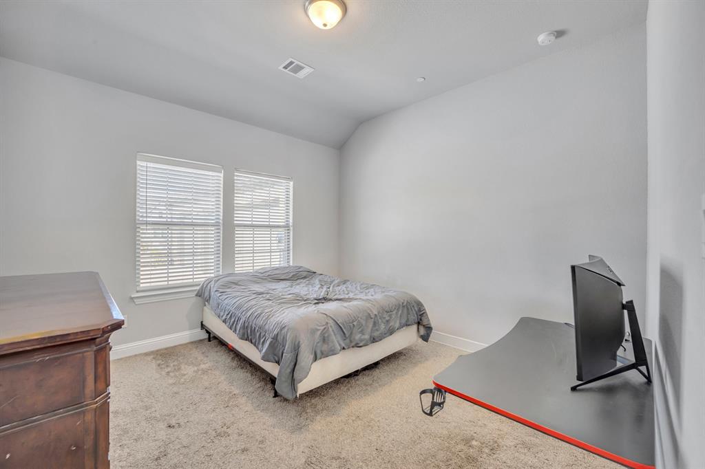 1340 Driftwood Lane Lucas, TX 75002 - Photo 22 of 23 a living room with a bed furniture and a window