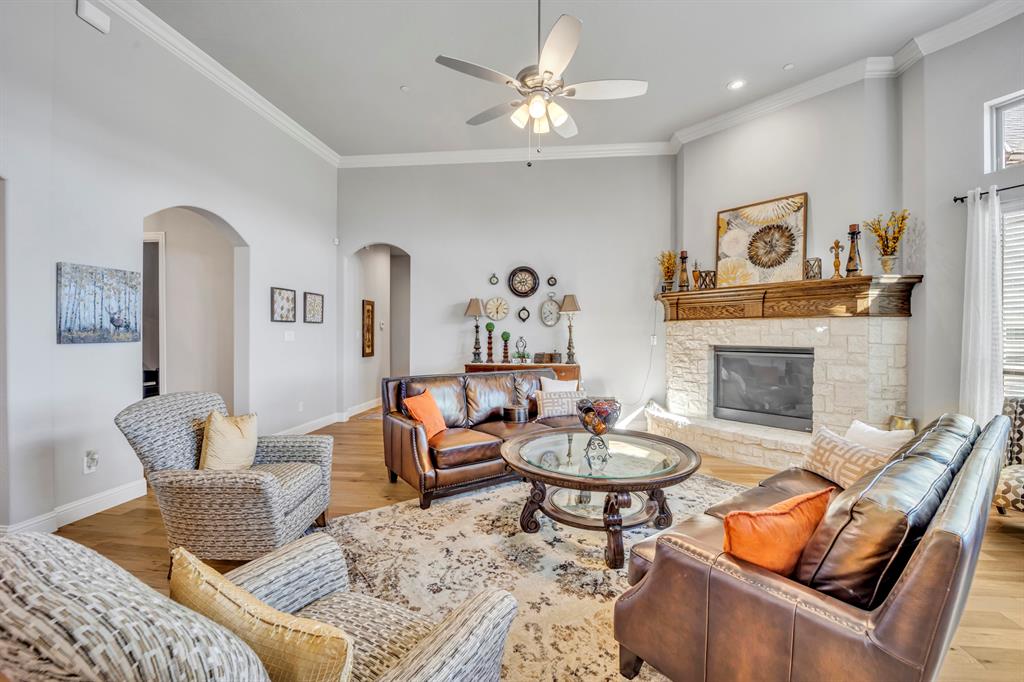 1340 Driftwood Lane Lucas, TX 75002 - Photo 8 of 23 a living room with furniture and a fireplace