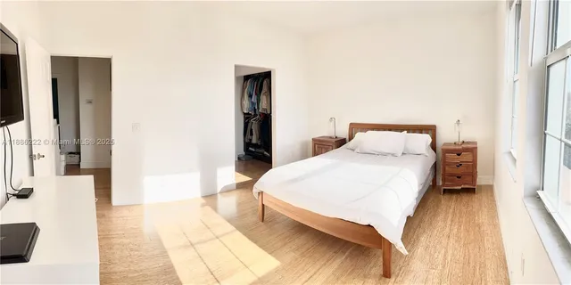 a bedroom with a bed and a table