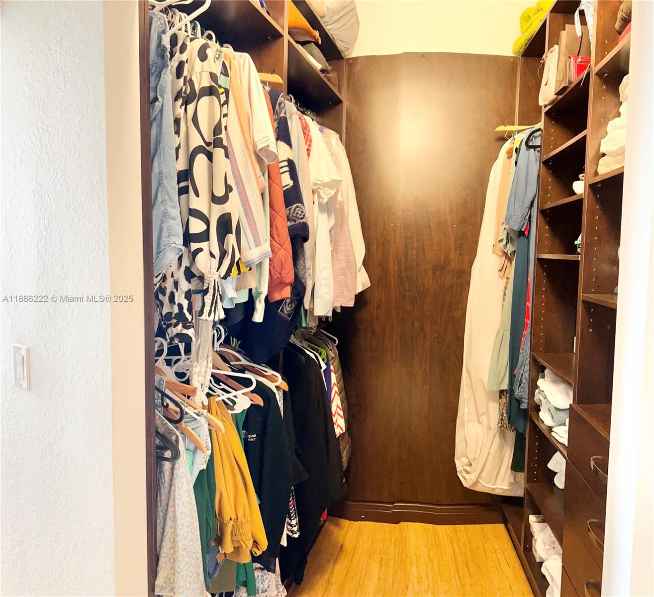 2549 Southwest 118th Way, Unit 302 Miramar, FL 33025 - Photo 21 of 43 a view of walk in closet with clothes and shoes