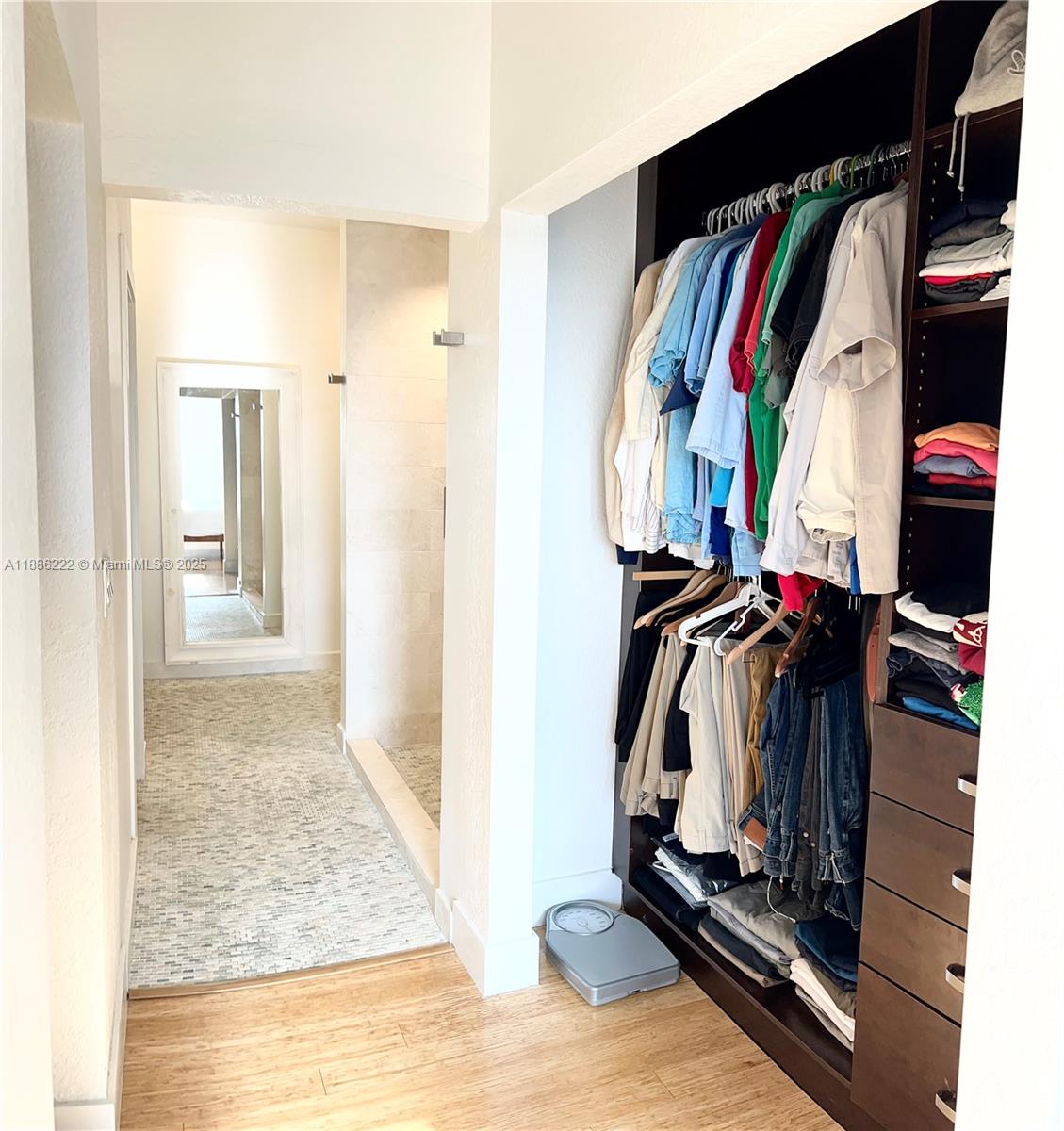 2549 Southwest 118th Way, Unit 302 Miramar, FL 33025 - Photo 22 of 43 a view of walk in closet with clothes and shoes