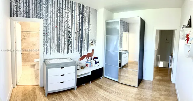 a view of a bedroom with windows