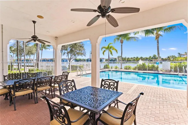 a outdoor dining space with furniture and outdoor view