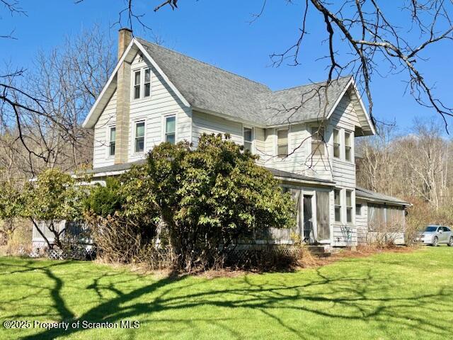 1079 Sutton Creek Road Dallas, PA 18612 - Photo 1 of 64 a front view of a house with a garden