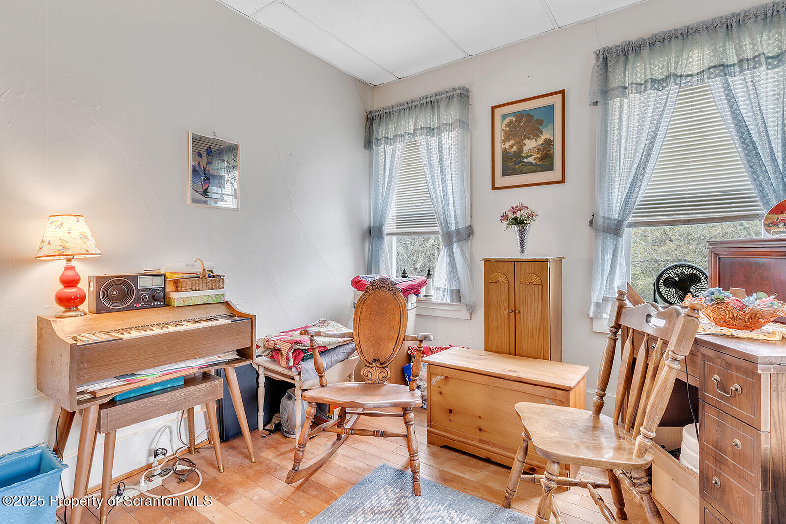 1079 Sutton Creek Road Dallas, PA 18612 - Photo 22 of 64 a view of a dining room with furniture window and wooden floor