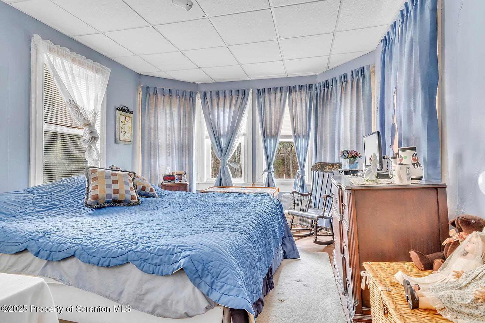 1079 Sutton Creek Road Dallas, PA 18612 - Photo 23 of 64 a spacious bedroom with a bed and large windows