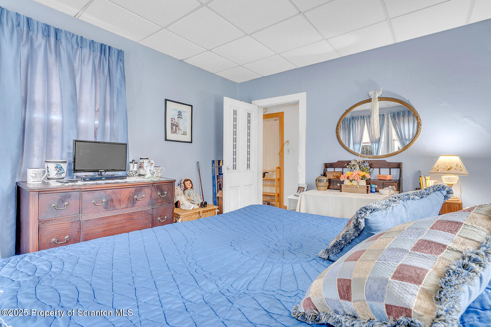 1079 Sutton Creek Road Dallas, PA 18612 - Photo 25 of 64 a bedroom with a bed and wooden floor