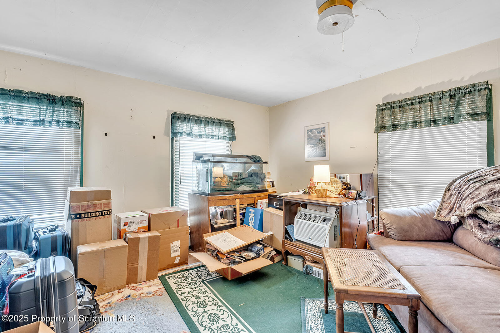 1079 Sutton Creek Road Dallas, PA 18612 - Photo 27 of 64 a living room with furniture and a table