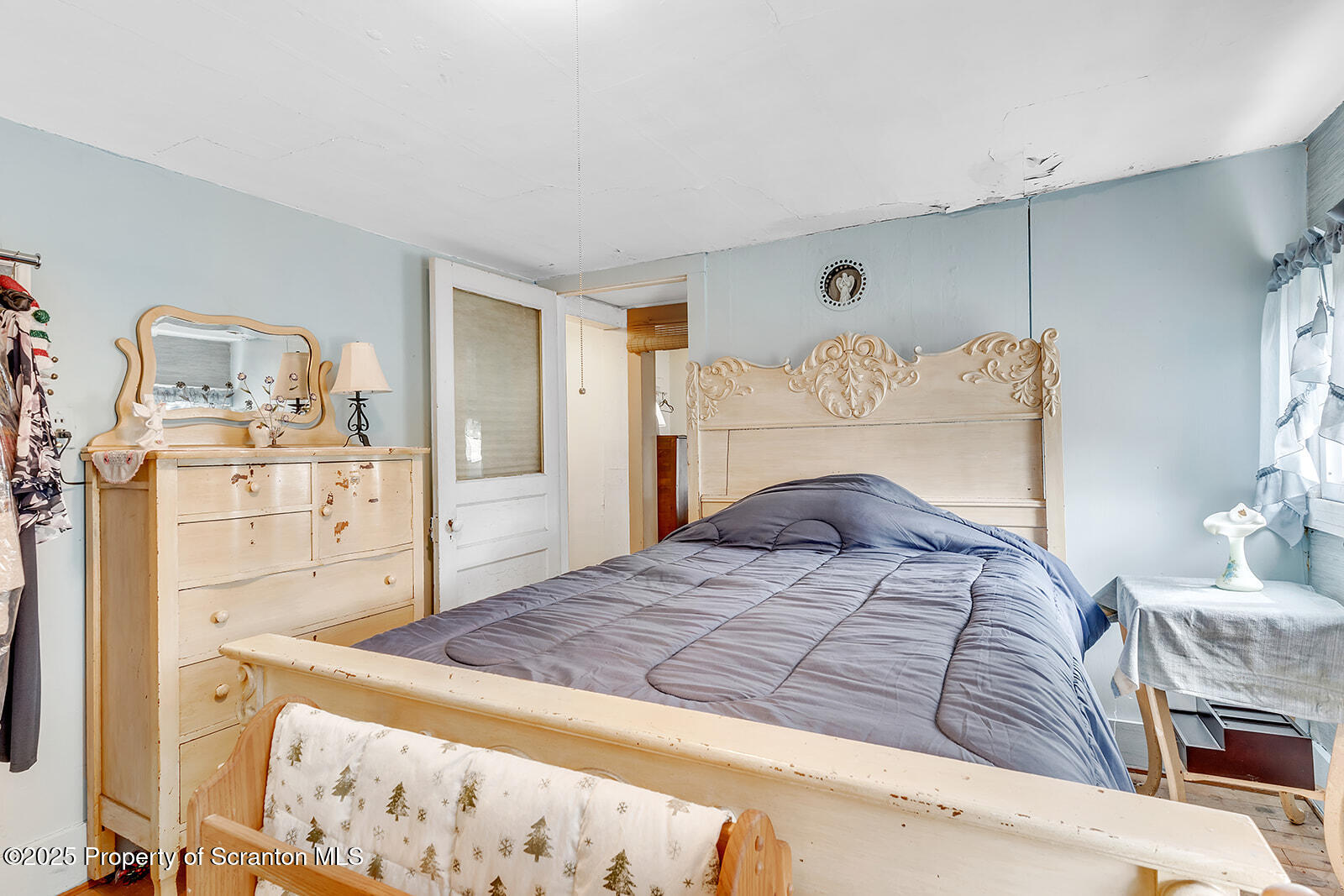 1079 Sutton Creek Road Dallas, PA 18612 - Photo 29 of 64 a bedroom with a bed and a cabinets