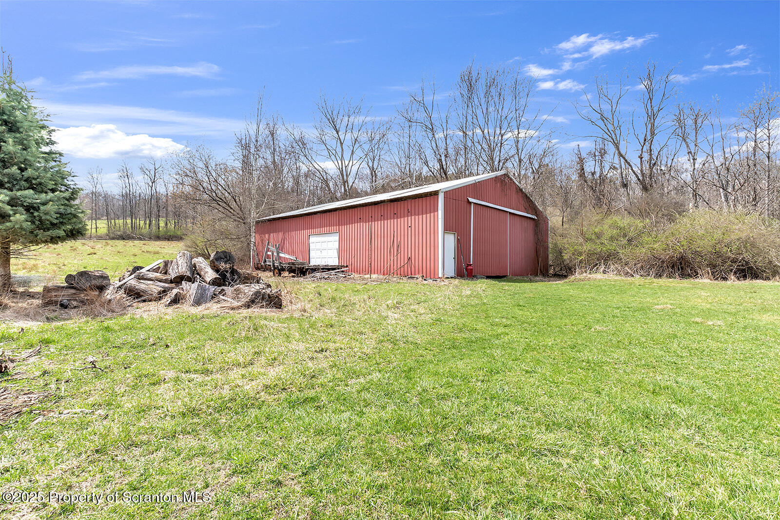 1079 Sutton Creek Road Dallas, PA 18612 - Photo 45 of 64 a view of a yard with yellow house