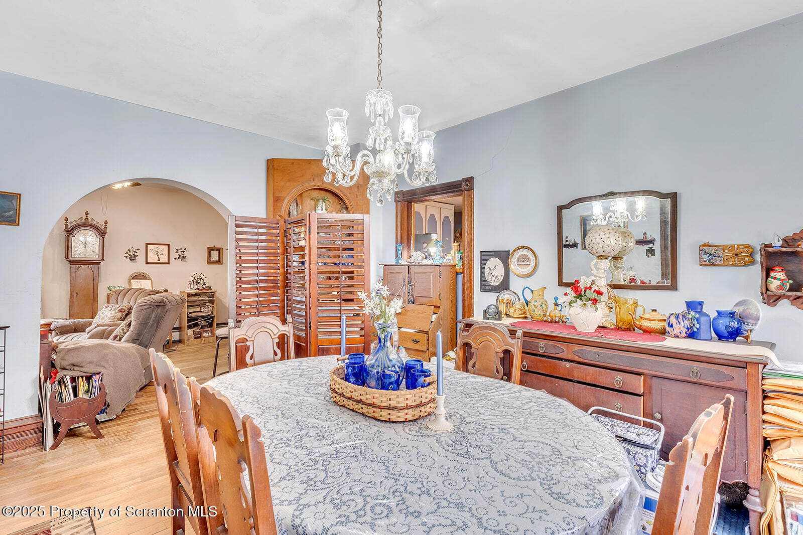 1079 Sutton Creek Road Dallas, PA 18612 - Photo 54 of 64 a living room with furniture and a chandelier
