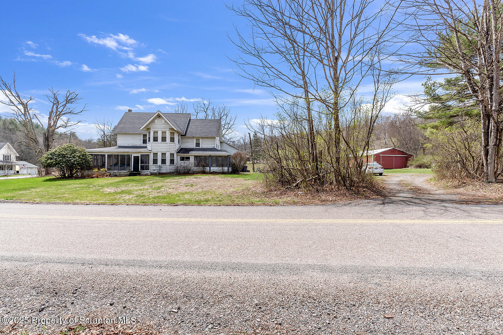 1079 Sutton Creek Road Dallas, PA 18612 - Photo 56 of 64 a view of a house with a yard