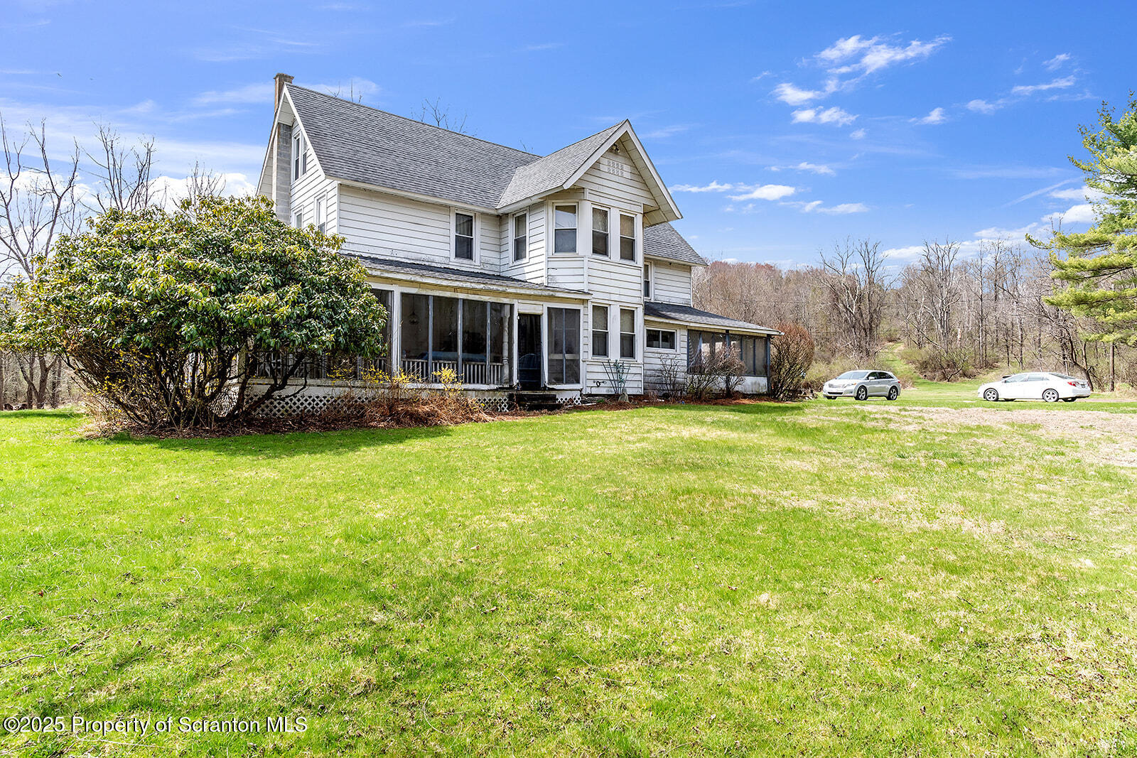 1079 Sutton Creek Road Dallas, PA 18612 - Photo 58 of 64 a view of a house with a big yard and potted plants