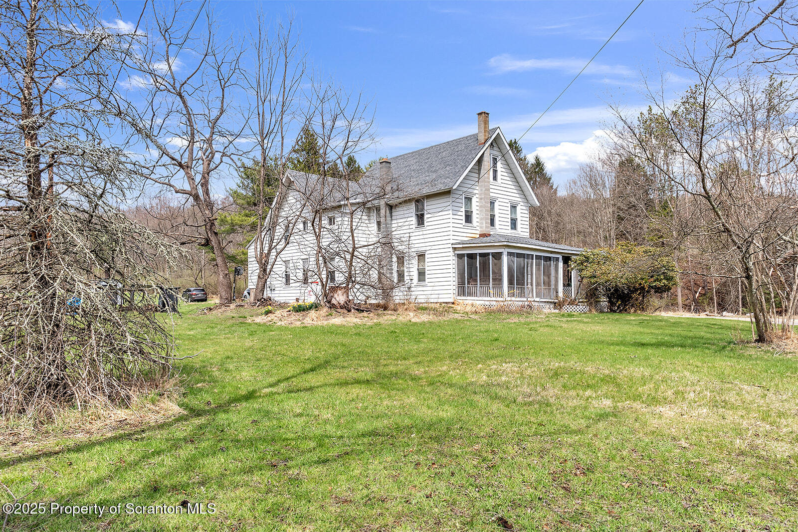 1079 Sutton Creek Road Dallas, PA 18612 - Photo 59 of 64 a front view of house with yard and green space